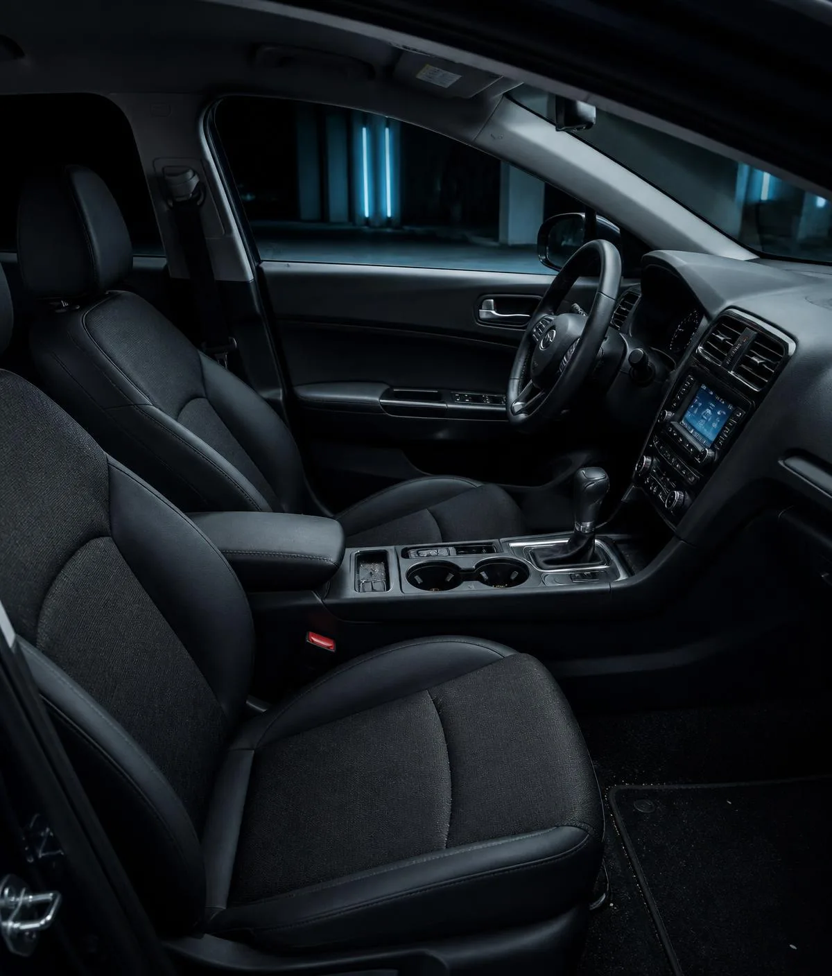 Everyday car interior with light dust and crumbs in the console, typical of routine interior mini detailing
