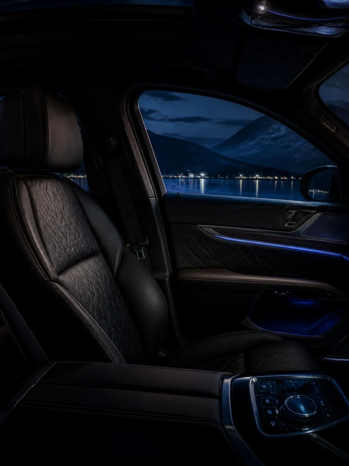 Detailed dark leather car cabin interior with ambient blue lighting