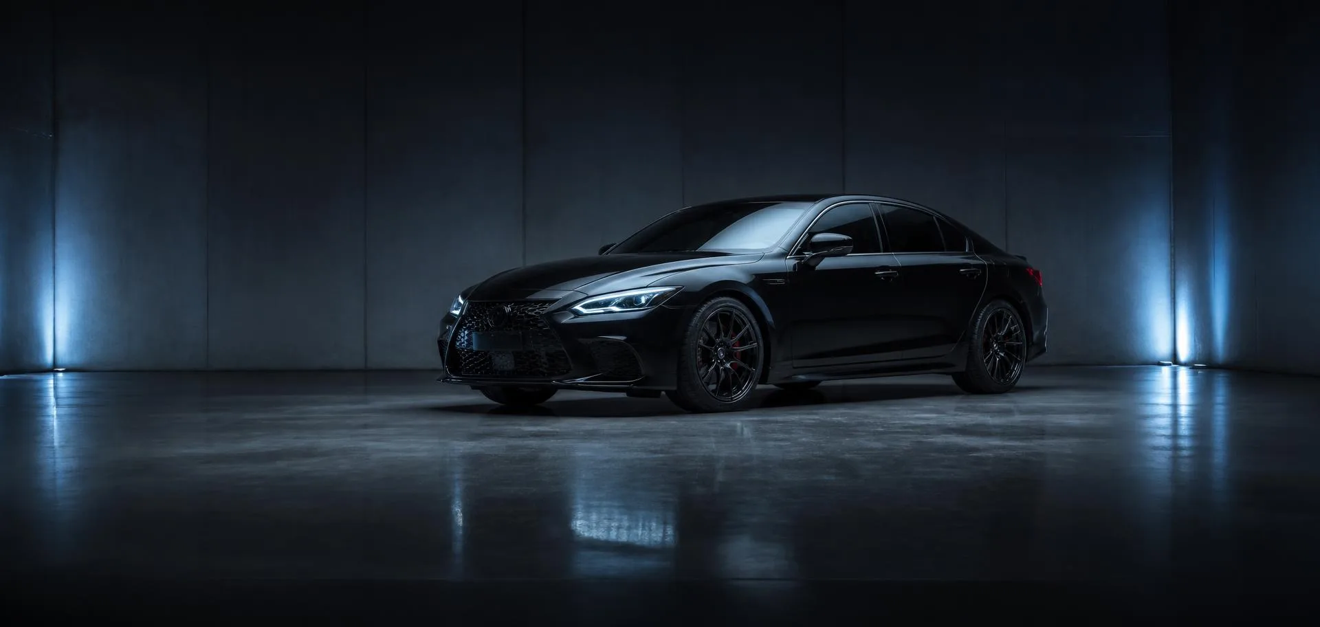 Glossy black luxury sedan alone in a dark studio with blue rim lighting