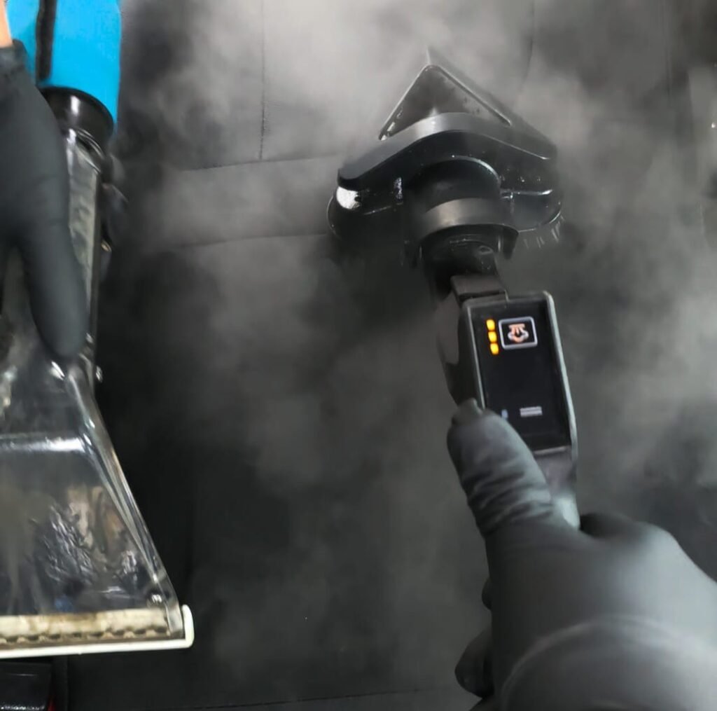 Steam cleaning as part of Premium Interior Detail service using hot vapor to sanitize and deep clean car interior surfaces