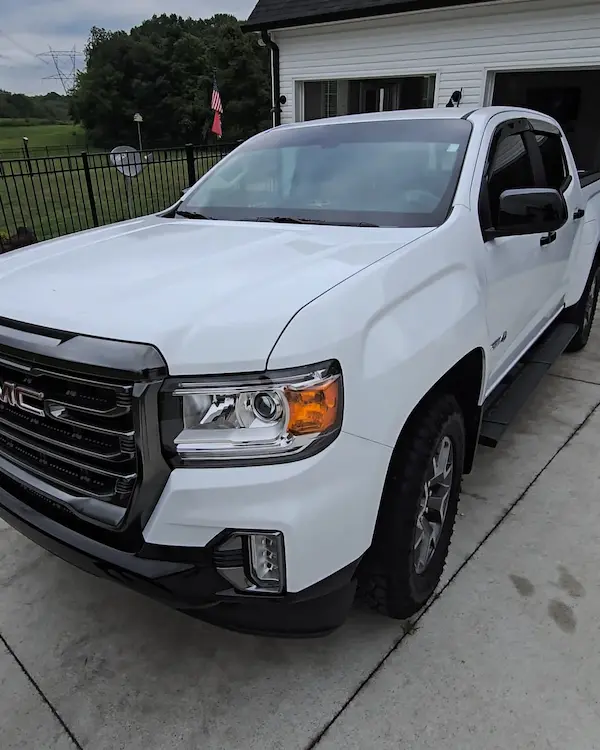 Mobile auto detailing service on a white GMC truck with professional exterior cleaning in Nashville